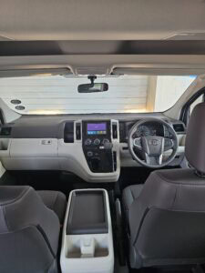 Quantum Dash Interior view of a vehicle dashboard and steering wheel.